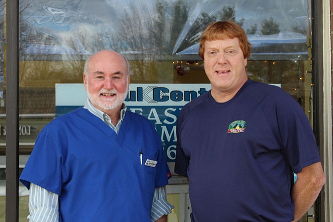 Dr. Randy Custer (left), owner and veterinarian at Georgetown Pike Veterinary Clinic, and John Homan, COO of Seneca Hill Veterinary Company, are preparing for the merger that will occur in the next few weeks. Photo Nikki Cheshire/The Connection